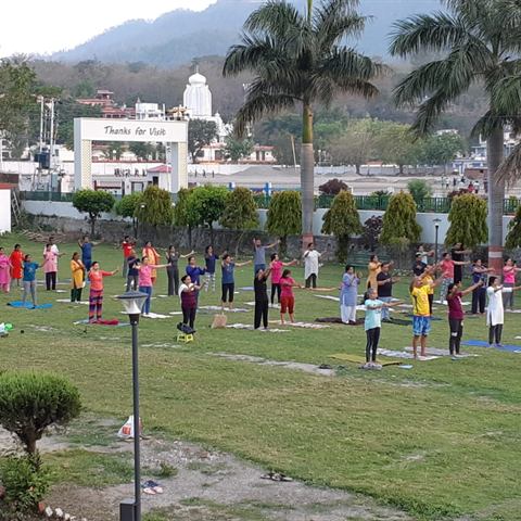 Group practice on the lawns in Rishikesh